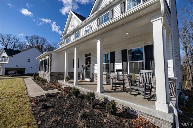 rear view of house featuring covered porch