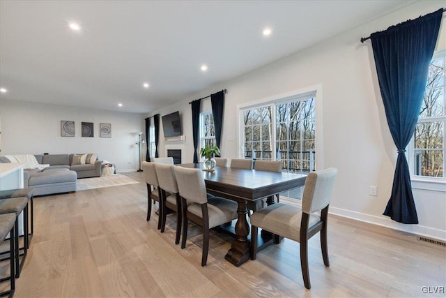 dining room with light wood-type flooring