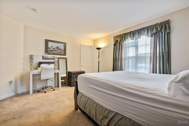 bedroom featuring light carpet