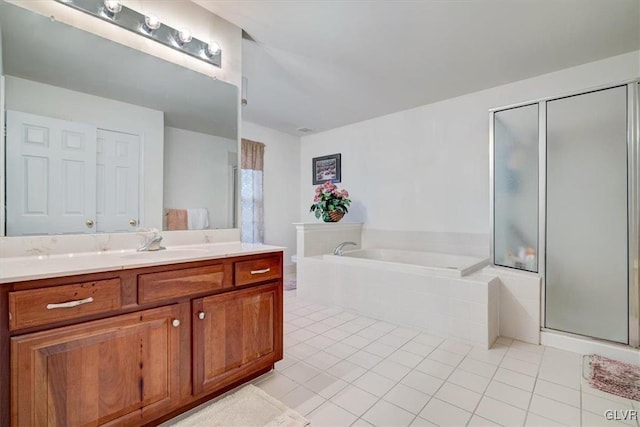 bathroom featuring tile patterned flooring, vanity, and separate shower and tub