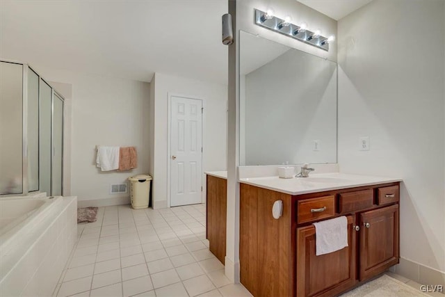 bathroom featuring tile patterned floors, vanity, and independent shower and bath