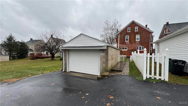 garage featuring a yard