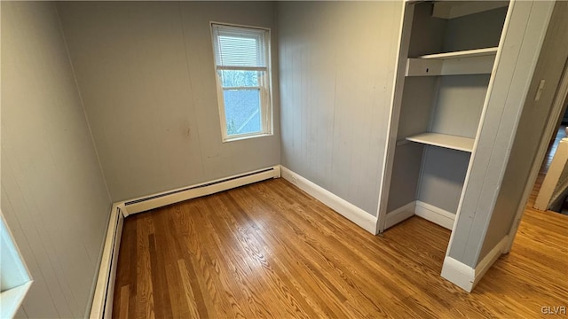 interior space featuring a baseboard heating unit