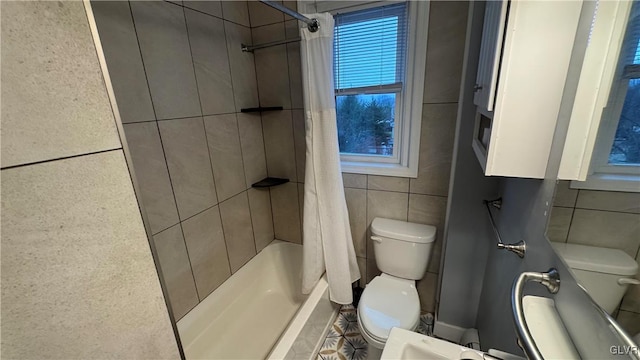 bathroom featuring toilet, shower / tub combo with curtain, and tile walls