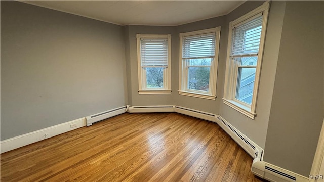 spare room with light hardwood / wood-style floors