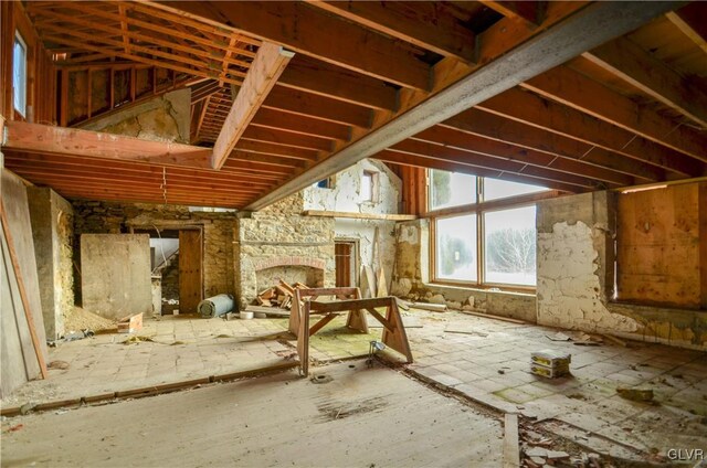 misc room featuring a stone fireplace