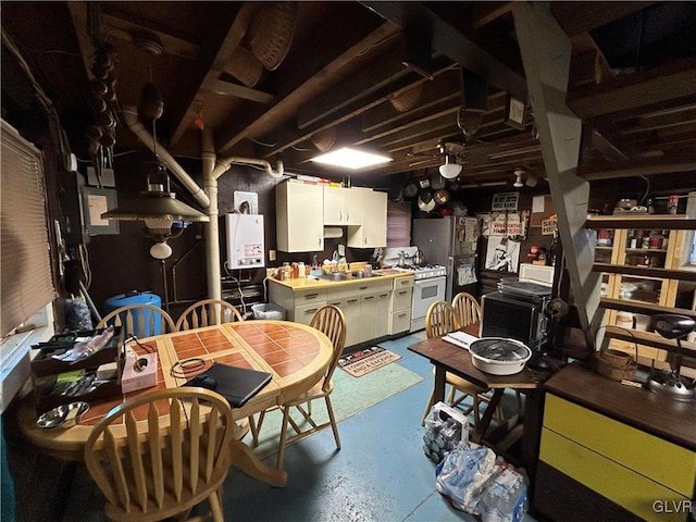 dining room featuring sink, concrete floors, ceiling fan, and water heater