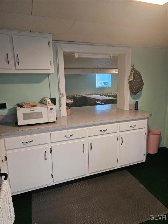 kitchen with white cabinetry