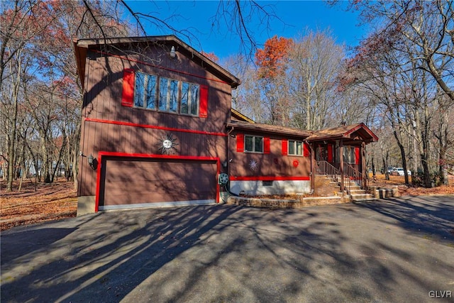 view of side of home with a garage