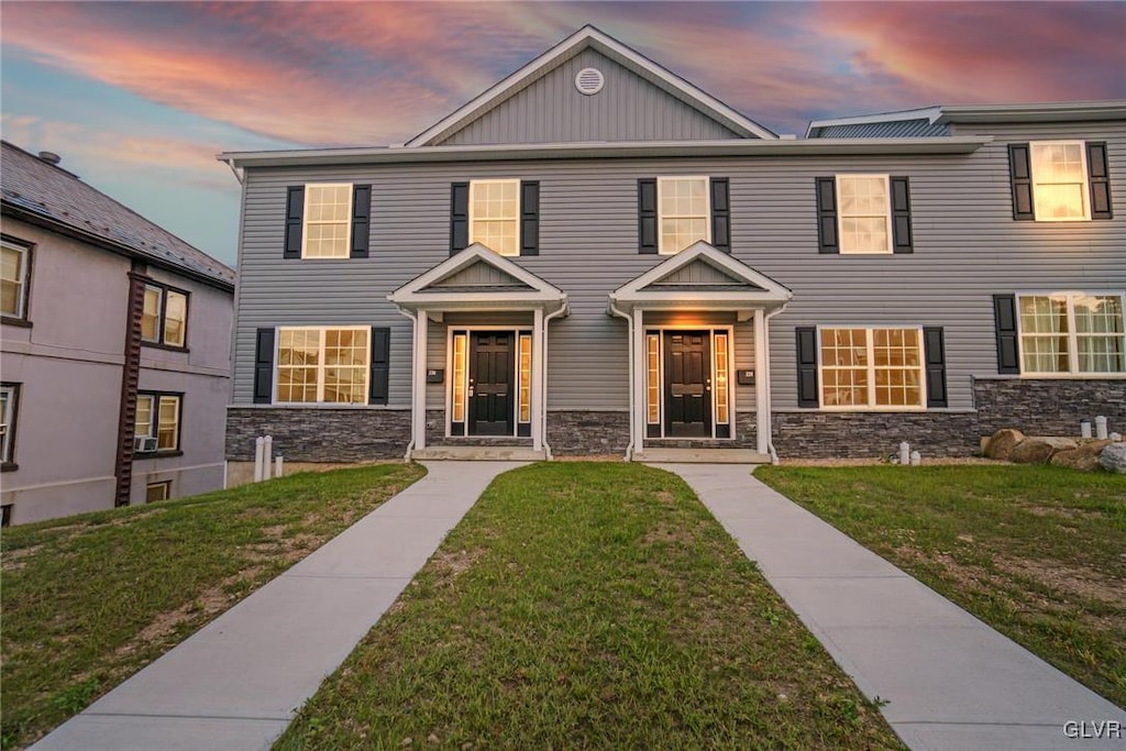 view of front of house with a lawn