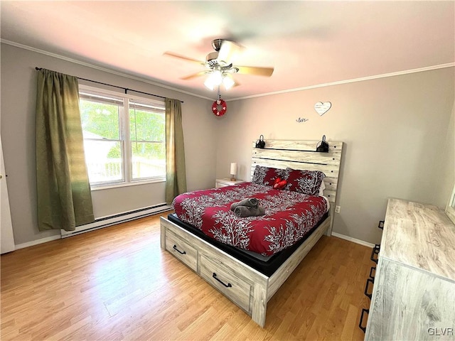 bedroom featuring ceiling fan, ornamental molding, light hardwood / wood-style floors, and a baseboard heating unit