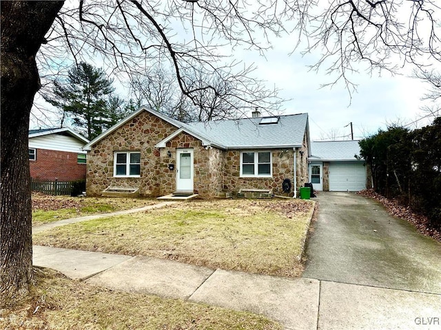 ranch-style home with a front lawn and a garage