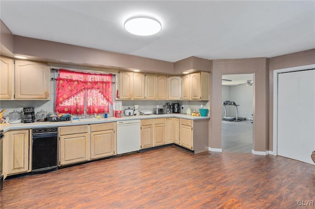 kitchen featuring ceiling fan, sink, white dishwasher, light brown cabinetry, and hardwood / wood-style flooring