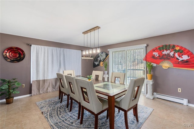 dining space featuring a baseboard heating unit