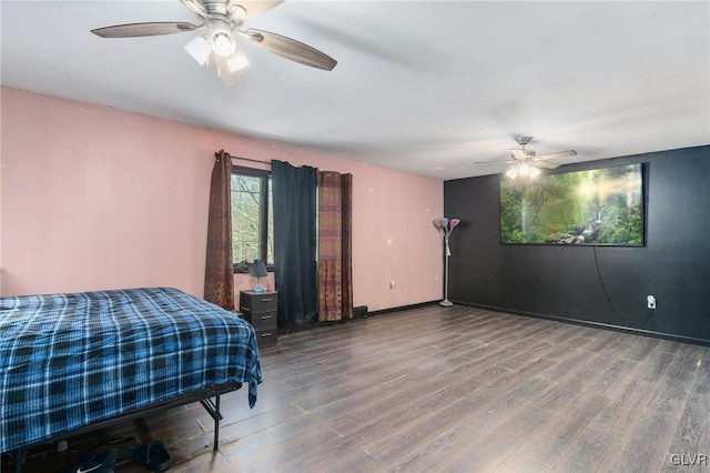 bedroom with hardwood / wood-style flooring and ceiling fan