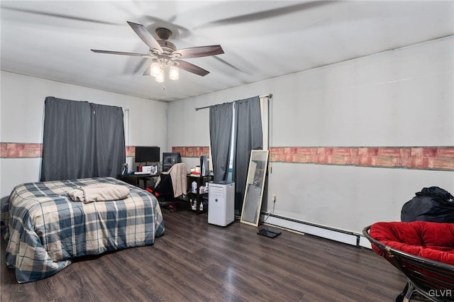 bedroom with ceiling fan, dark hardwood / wood-style floors, and a baseboard heating unit