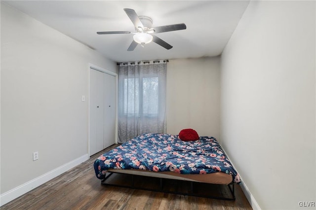 bedroom with wood-type flooring, a closet, and ceiling fan