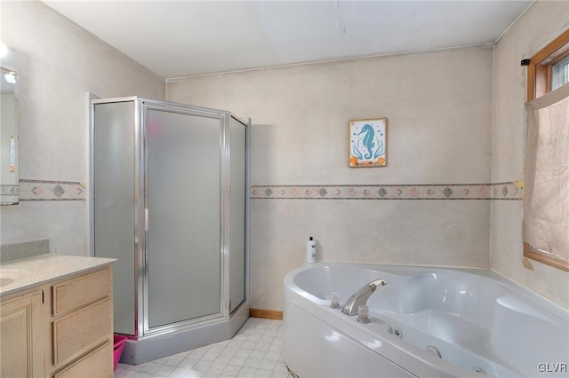 bathroom featuring separate shower and tub, tile patterned floors, and vanity