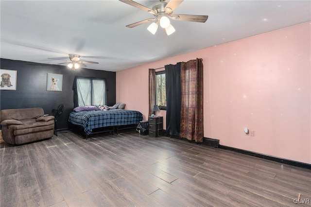 bedroom featuring ceiling fan and dark hardwood / wood-style flooring