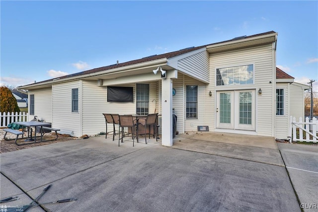 back of property with a patio area