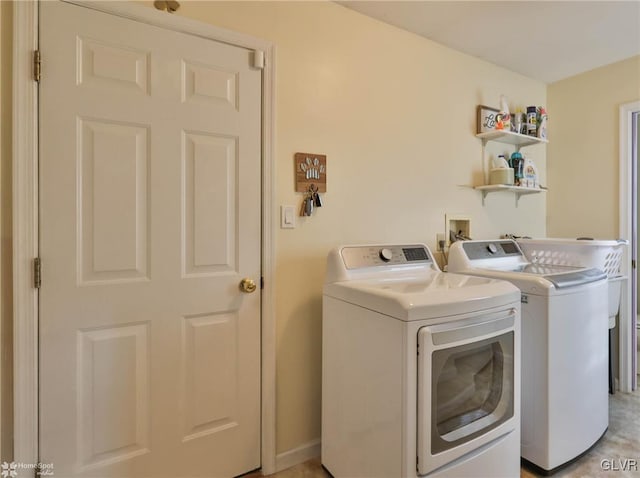 washroom with washing machine and dryer