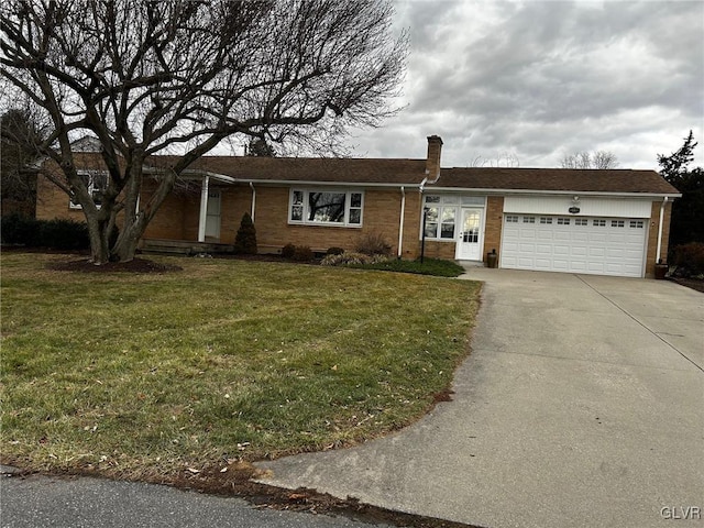 single story home featuring a front lawn and a garage