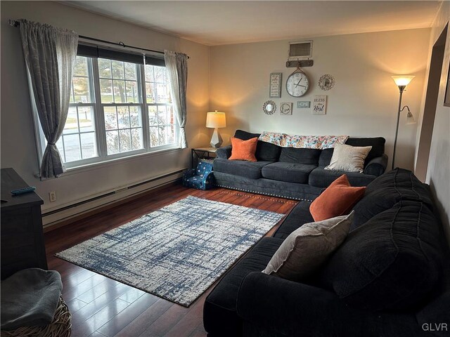 living room featuring dark hardwood / wood-style flooring and a baseboard radiator