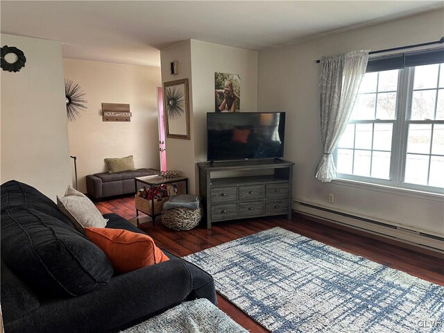 living room featuring baseboard heating and dark hardwood / wood-style flooring