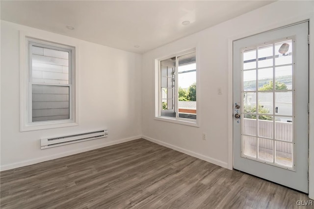 doorway featuring dark hardwood / wood-style flooring and a baseboard radiator