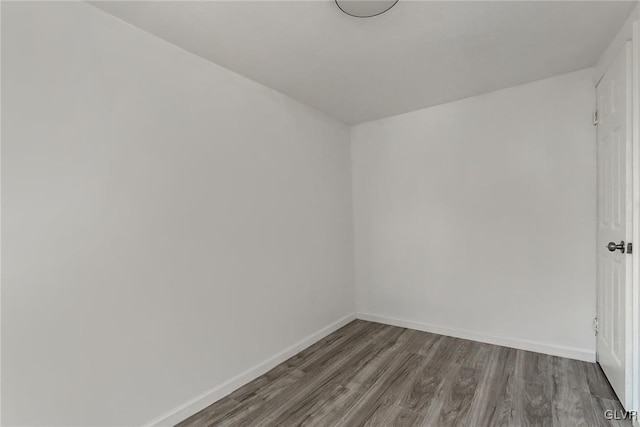 spare room with wood-type flooring