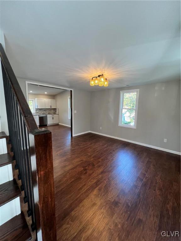 empty room featuring dark hardwood / wood-style floors