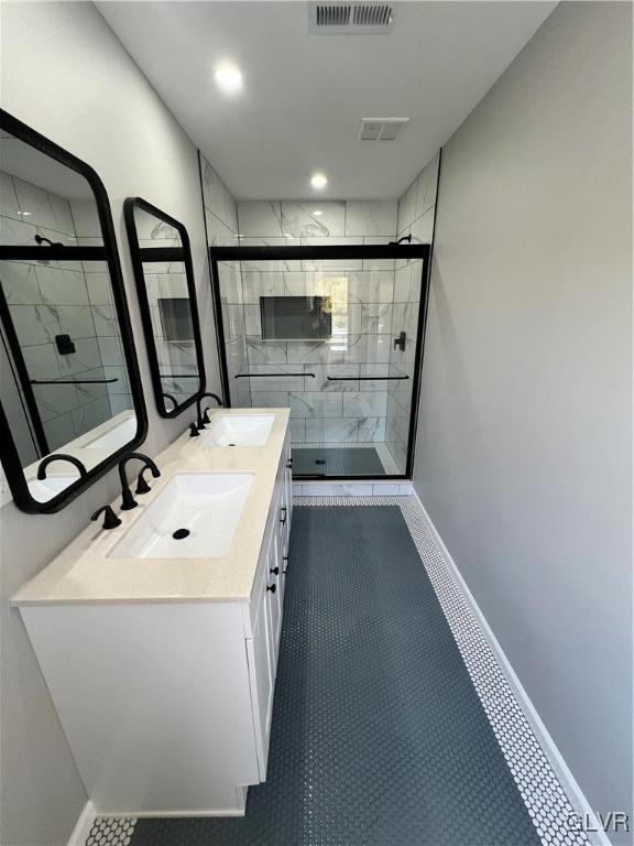 bathroom with vanity, tile patterned floors, and an enclosed shower