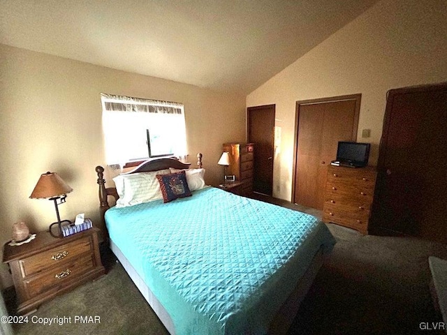 carpeted bedroom with vaulted ceiling