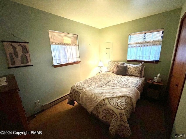 bedroom featuring a baseboard heating unit