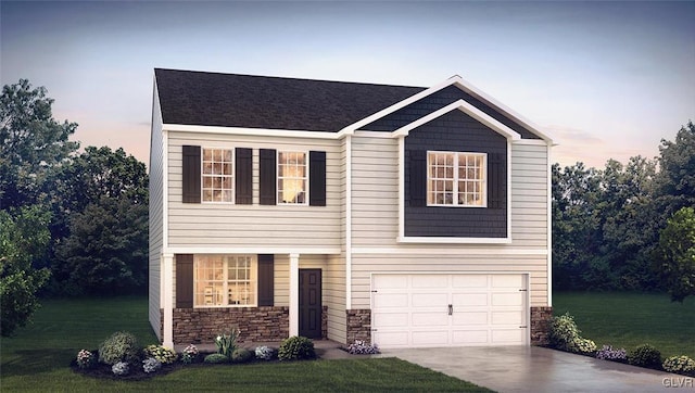 view of front of property featuring a garage and a lawn