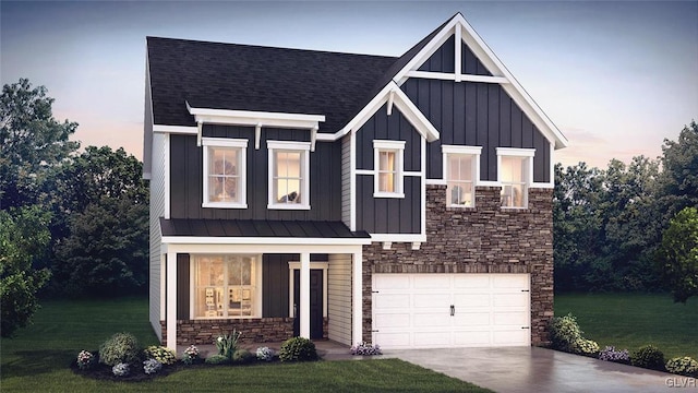 view of front of property featuring a garage and a yard