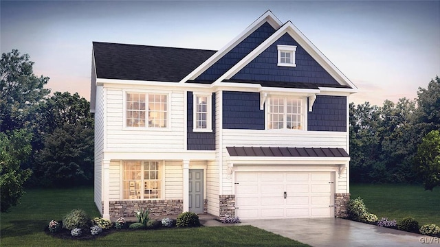 craftsman-style house featuring a lawn and a garage