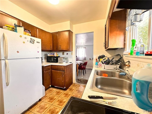 kitchen with white fridge and sink