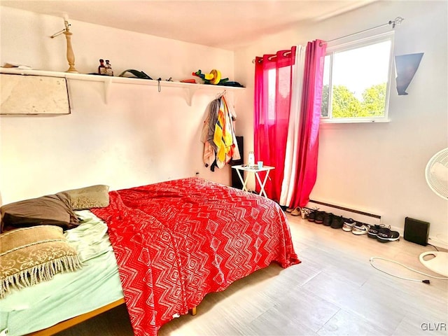 bedroom with a baseboard radiator