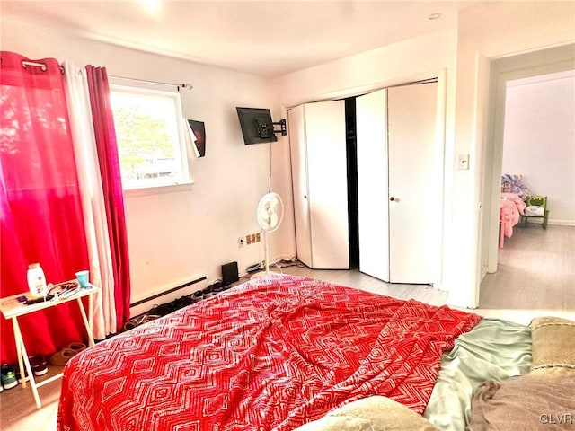 bedroom featuring a baseboard radiator