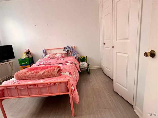 bedroom featuring light wood-type flooring