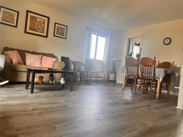 sitting room featuring dark wood-type flooring