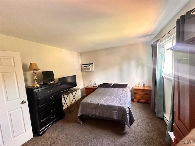 bedroom featuring dark carpet, a wall unit AC, and a baseboard radiator