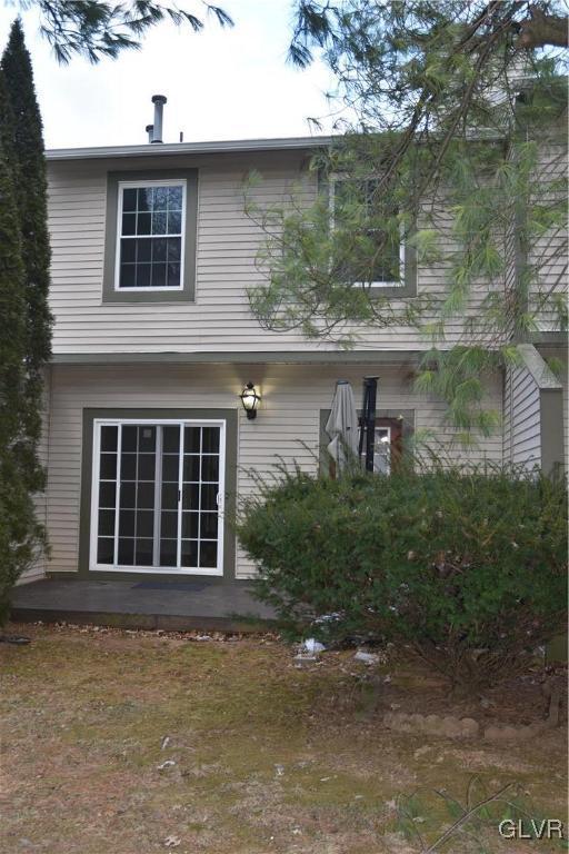 back of house with a patio area