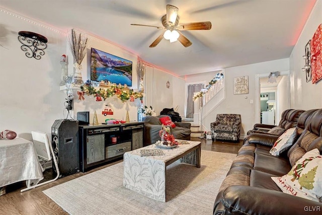 living room with ceiling fan and hardwood / wood-style flooring