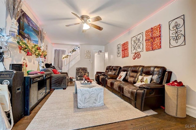 living room with ceiling fan and dark hardwood / wood-style flooring