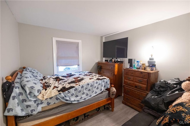 bedroom with light hardwood / wood-style floors