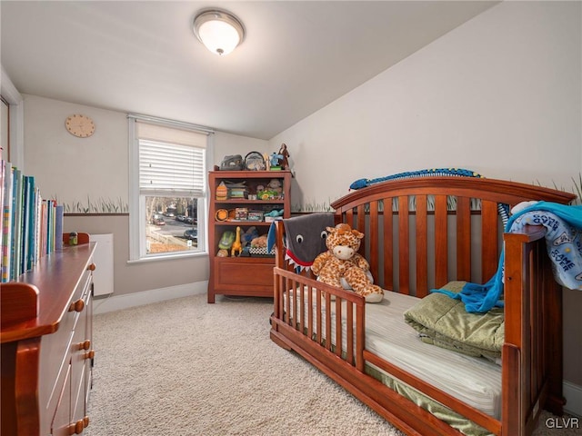 bedroom featuring carpet floors and vaulted ceiling