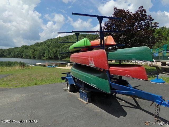 view of jungle gym with a water view