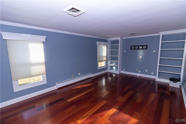 empty room featuring dark hardwood / wood-style floors, built in features, a wealth of natural light, and a baseboard heating unit